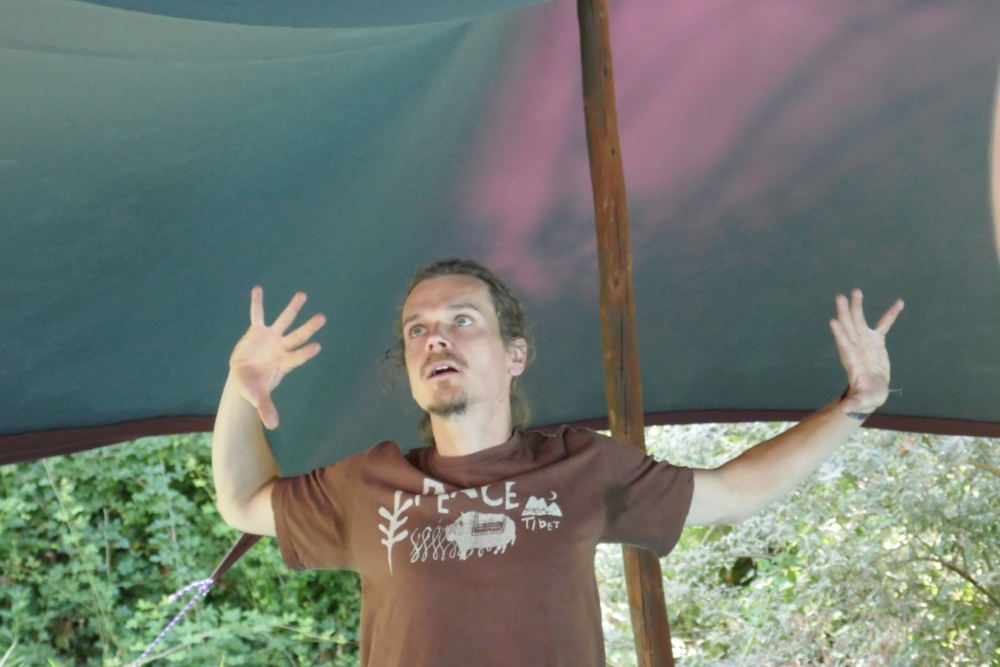 profile image of Jan teaching workshop in a tent